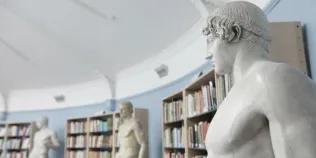 Statue and bookshelves in the Student Research Room