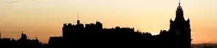 The Edinburgh skyline silhouetted against the sunset.