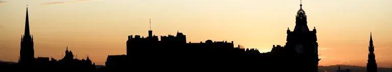 The Edinburgh skyline silhouetted against the sunset.