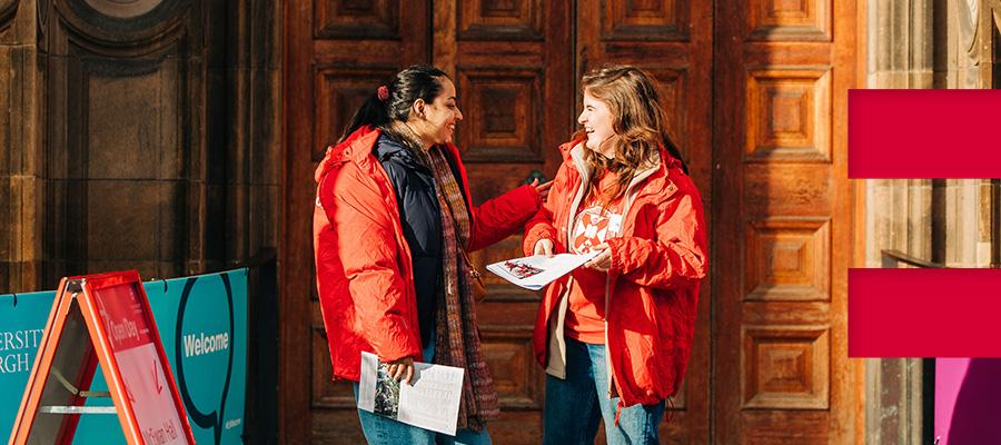 Two students chat outside the McEwan Hall at an Open Day event