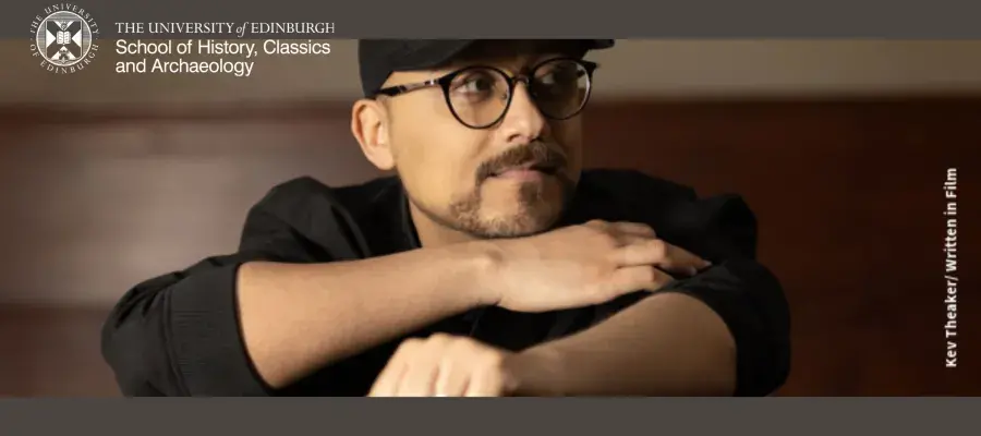 Yemeni pianist Saber Bamatraf wears dark-rimmed glasses. He has a light moustache and beard.