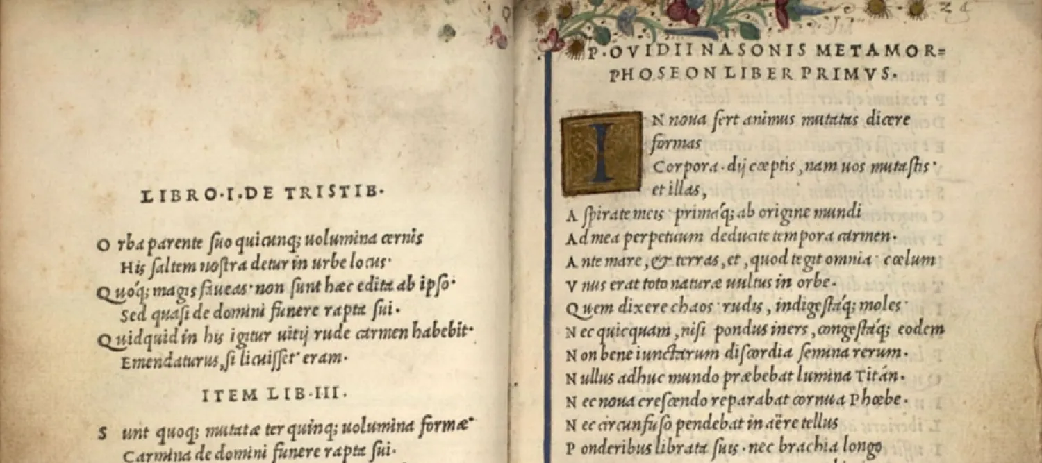 A close up of a double-page spread from Ovid's first volume of the Aldine edition of Ovid's works (Venice: 1502), including "Metamorphoses", which is embellished with MS decoration and illumination.