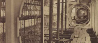 Reconstruction of the upper gallery of the Crystal Palace in 1854 showing the metal frame, and a walkway of wooden planks.