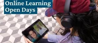 A student listens in to an online lecture on a tablet using headphones