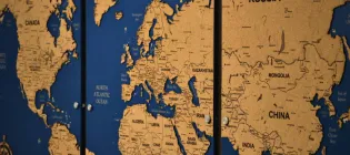 Close up of a blue and sand-coloured map of the world