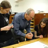 Professor Peltenburg shows off the Childe Collection