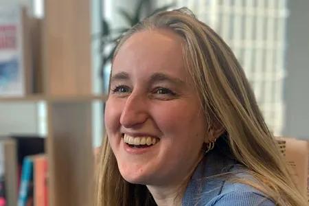 Gabi has long blonde hair and is laughing