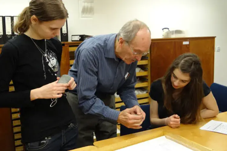 Professor Peltenburg shows off the Childe Collection