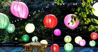 Colorful Parachute Lamps Hanged on Ropes At Night