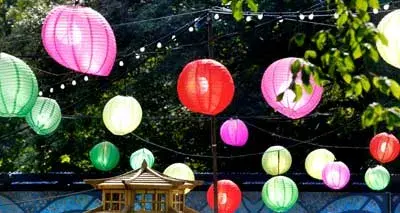 Colorful Parachute Lamps Hanged on Ropes At Night