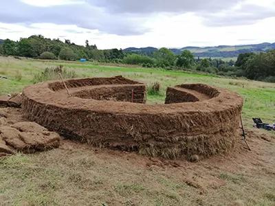 A turf wall at Comrie Croft eco-farm after a build time of approximately 25 hours. Solid, safe and ecologically sound. (Imag