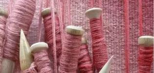 Bobbins of different shades of pink yarn