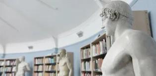 Statue and bookshelves in the Student Research Room